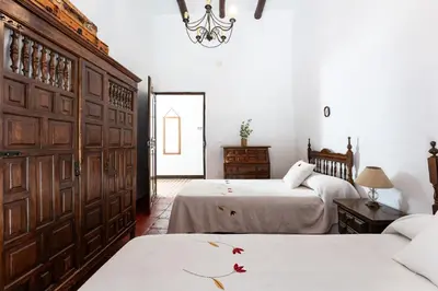 Cama o camas de una habitación en MalagaSuite Bobadilla Casa Rural
