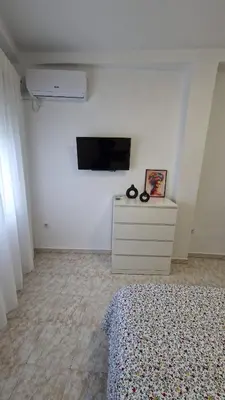 Una televisión o centro de entretenimiento en Azahar de Córdoba Apartment