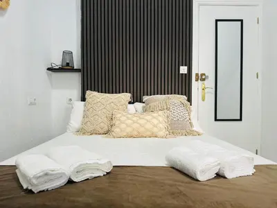 Cama o camas de una habitación en Rooms Cruz Roja