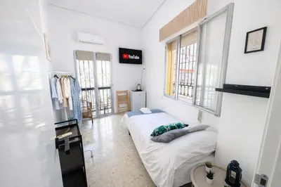 Cama o camas de una habitación en Rooms Cruz Roja