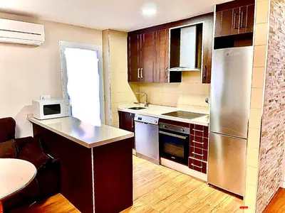 Una cocina o zona de cocina en LA PAZ 2 Dormitorios PONDOS