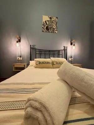 Cama o camas de una habitación en El Rincón del Tuno