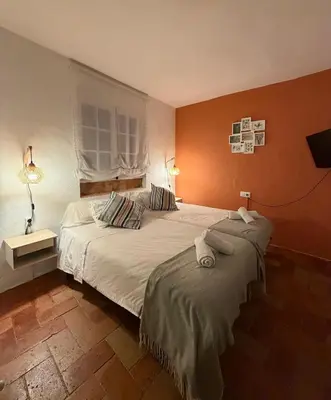 Cama o camas de una habitación en El Rincón del Tuno
