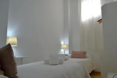 Cama o camas de una habitación en Sunshine Jardin de Orive