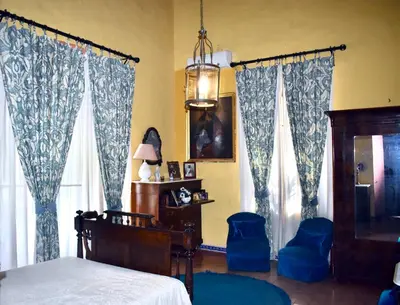 Una televisión o centro de entretenimiento en Casa Palacio de los Palma