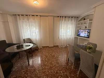 Una televisión o centro de entretenimiento en AVENIDA CENTRO 2 Dormitorios PONDOS