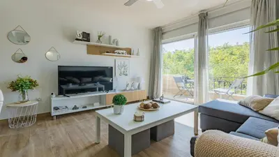 Una televisión o centro de entretenimiento en Apartamento Sol de Libia Cordoba