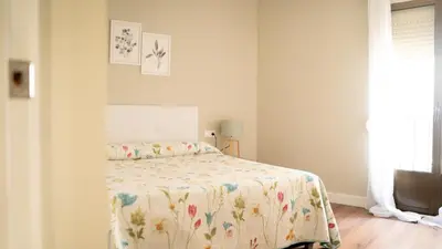 Cama o camas de una habitación en Suites Cañizares Catedral