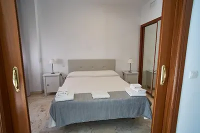 Cama o camas de una habitación en Apartamento con piscina solo en temporada