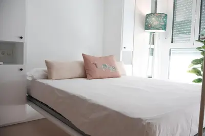 Cama o camas de una habitación en MonKeys Apartments Quintana C2