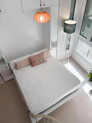 Cama o camas de una habitación en MonKeys Apartments Quintana C2