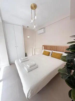 Cama o camas de una habitación en MonKeys Apartments Quintana C2