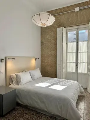 Cama o camas de una habitación en Unique Sevilla