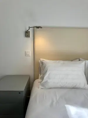 Cama o camas de una habitación en Unique Sevilla