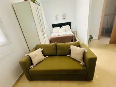 Cama o camas de una habitación en Apartamentos Macarena Centro Histórico