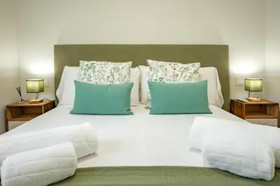 Cama o camas de una habitación en Bustos Tavera Central