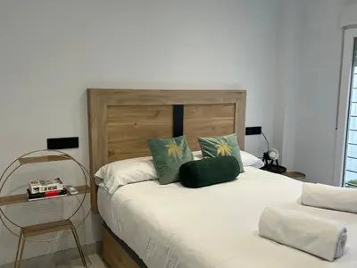 Cama o camas de una habitación en Únika Homes Nervión & Terrace