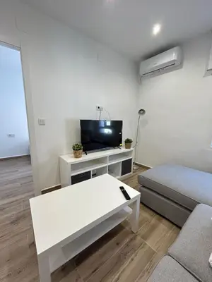 Una televisión o centro de entretenimiento en Apartamento Escañuela