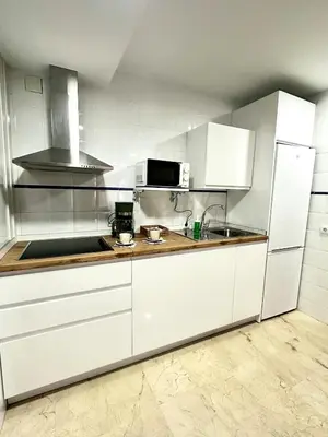 Una cocina o zona de cocina en Apartamento Azahar Centro Parking Gratis