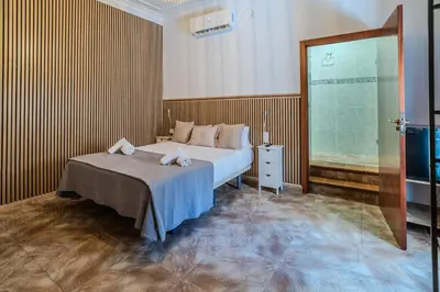 Cama o camas de una habitación en La Pimentera Rooms
