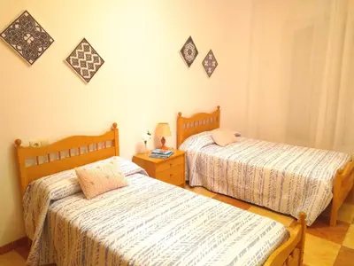 Cama o camas de una habitación en Piso Calle Pelayo