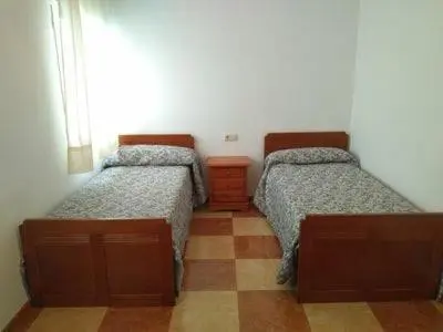 Cama o camas de una habitación en Piso Calle Pelayo