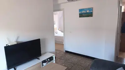 Una televisión o centro de entretenimiento en Apartamento de la Luz en exclusividad