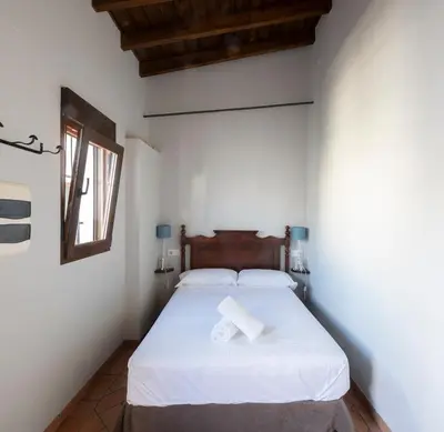 Cama o camas de una habitación en Hospedería Monasterio de San Leandro