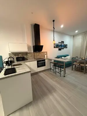 Una cocina o zona de cocina en Apartamentos Álamo