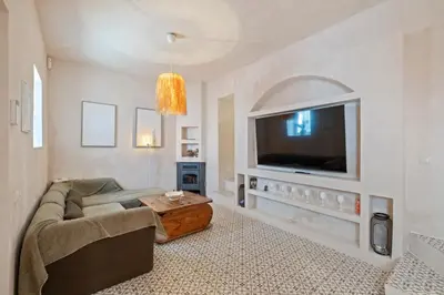 Una televisión o centro de entretenimiento en Casa Leone