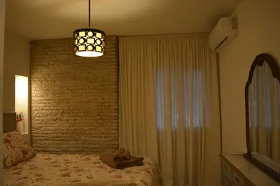 Cama o camas de una habitación en Casa Macarena Sunflower