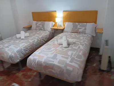 Cama o camas de una habitación en Plaza Ayuntamiento 2 habitaciones B&A