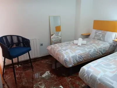 Cama o camas de una habitación en Plaza Ayuntamiento 2 habitaciones B&A