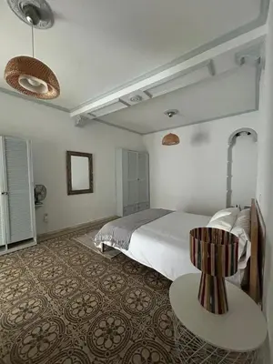 Cama o camas de una habitación en Un patio en La Alameda