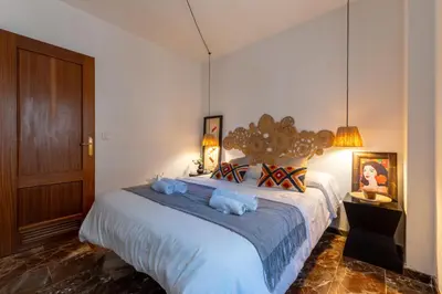 Cama o camas de una habitación en Apartamento con Parking El Patio de La Muralla