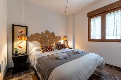 Cama o camas de una habitación en Apartamento con Parking El Patio de La Muralla