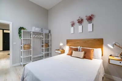 Cama o camas de una habitación en RentalSevilla Plaza de San Quintín II