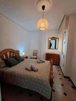 Cama o camas de una habitación en Apartamento N IV La Carolina Jaén