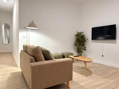Una televisión o centro de entretenimiento en Suite Osario
