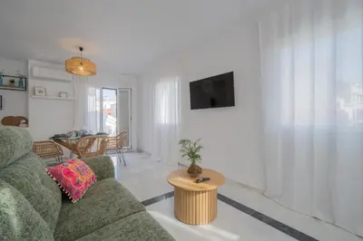 Una televisión o centro de entretenimiento en Suite Terraza Mezqita Free Parking