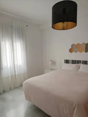 Cama o camas de una habitación en Living Sevilla & Parking gratis