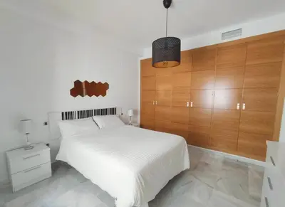Cama o camas de una habitación en Living Sevilla & Parking gratis