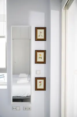 Cama o camas de una habitación en FAM Sevillian Apartment