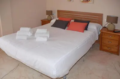 Cama o camas de una habitación en CASA PATIO LAS PALMERAs 3 y 4