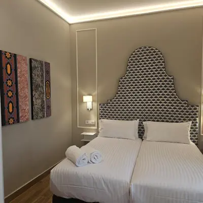 Cama o camas de una habitación en Puerta de la Ribera Centro