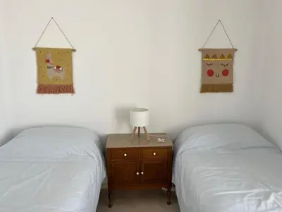 Cama o camas de una habitación en Casa con jardín y piscina en Córdoba