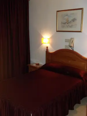 Cama o camas de una habitación en Hostal San Francisco