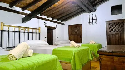Cama o camas de una habitación en Suitur Cortijo de Don Lolo