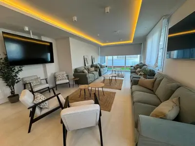 Zona de estar de ZAHIRA Homes