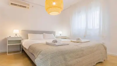 Cama o camas de una habitación en Apartamento Luz de Macarena en Sevilla